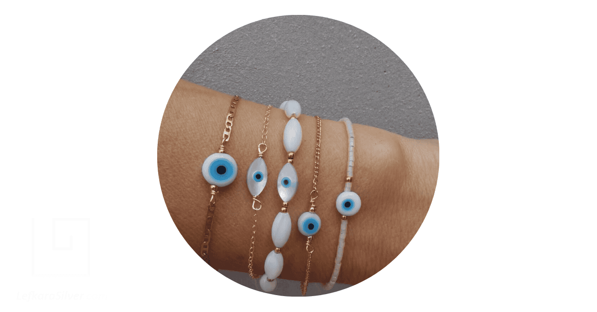 a person wearing the popular evil eye Ayia Napa jewellery