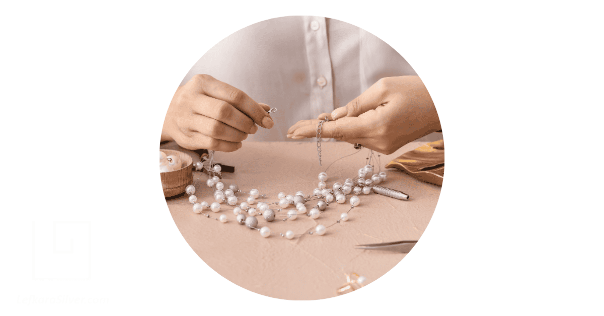 a woman handmaking a pearl necklace depicting Cyprus Handmade products