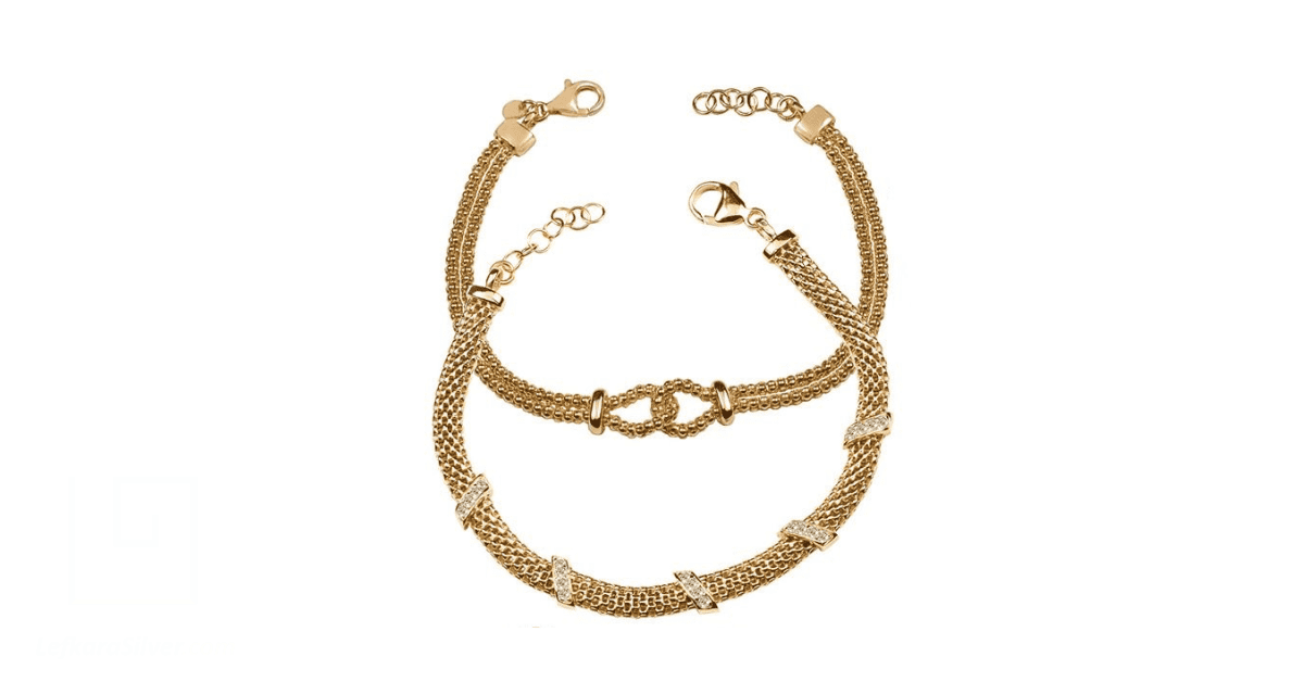 A Pair of gold Paphos jewellery neck pieces
