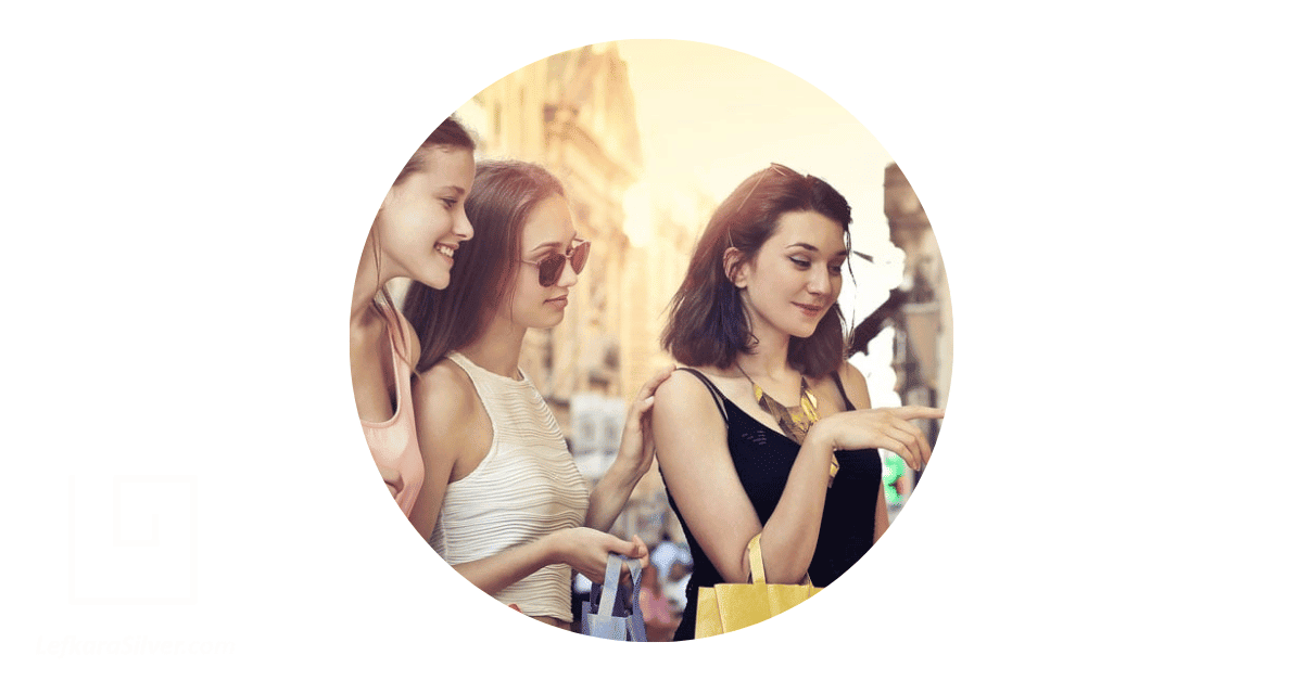 three ladies exploring a market for Paralimni jewellery