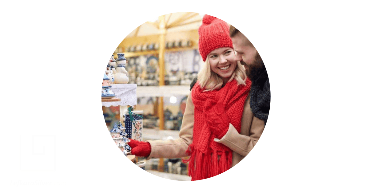 a couple smiling as they explore handicrafts in a shop in Cyprus