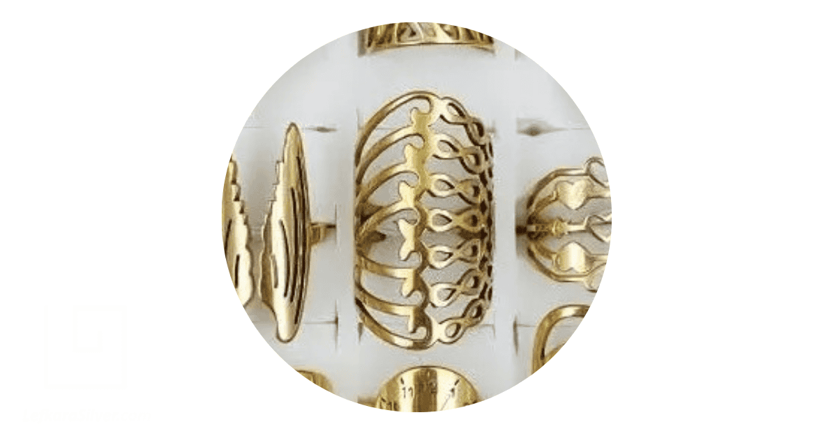 A collection of gold filigree rings with different designs