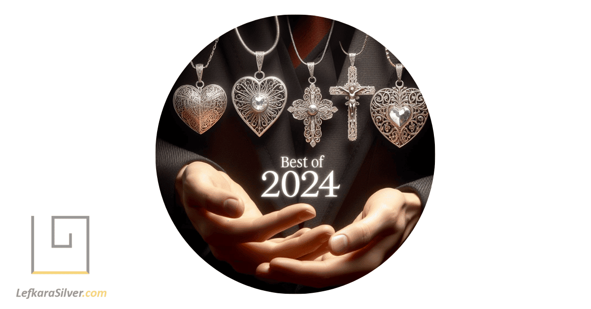 A person displaying five different filigree pendants, some in silver and some in gold, each one unique and considered the best of 2024, with the text: Best of 2024. One pendant is a heart, another is a cross pendant.