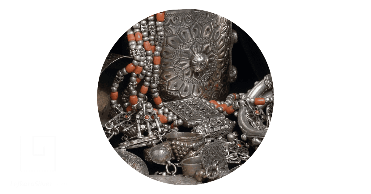 a collection of vintage silver plated jewelry