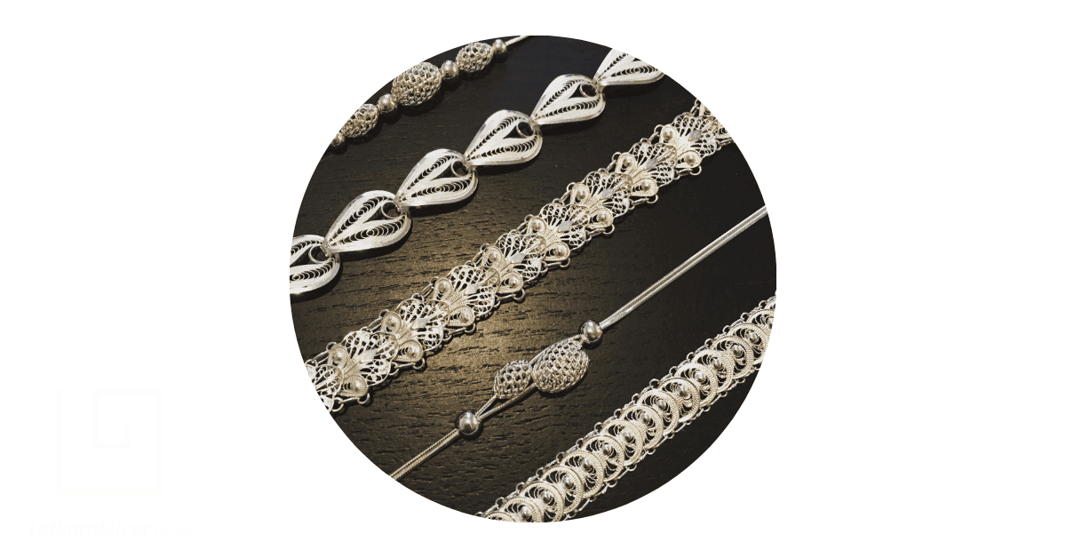 a small collection of silver filigree bracelets