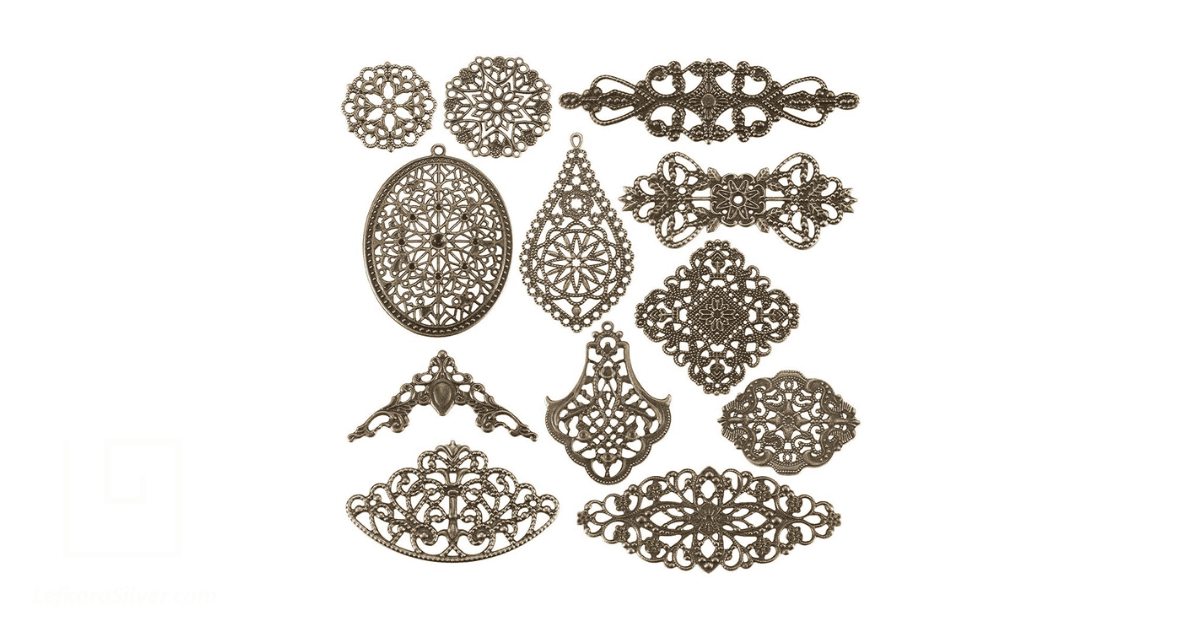 several filigree pendants on display