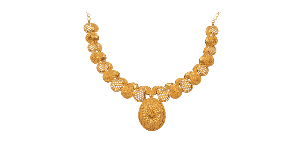 a gold filigree necklace on a white background