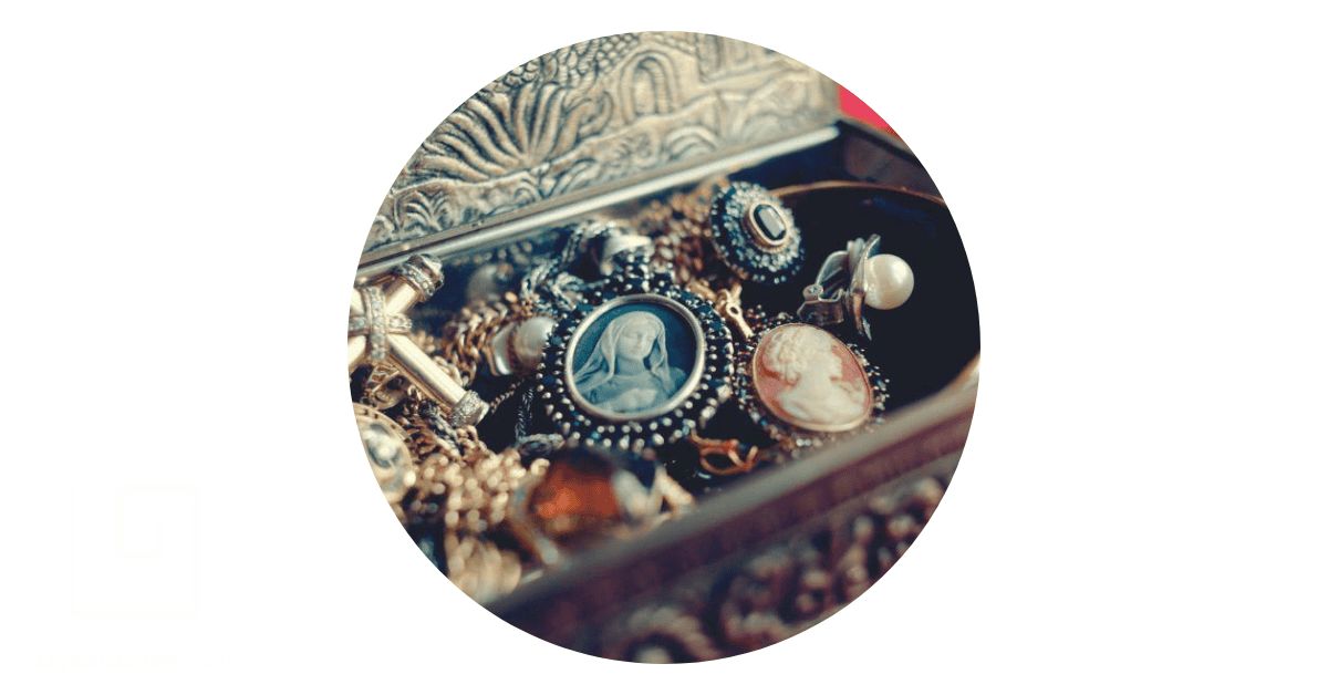 a personal collection of silver vintage jewelry in a jewelry box