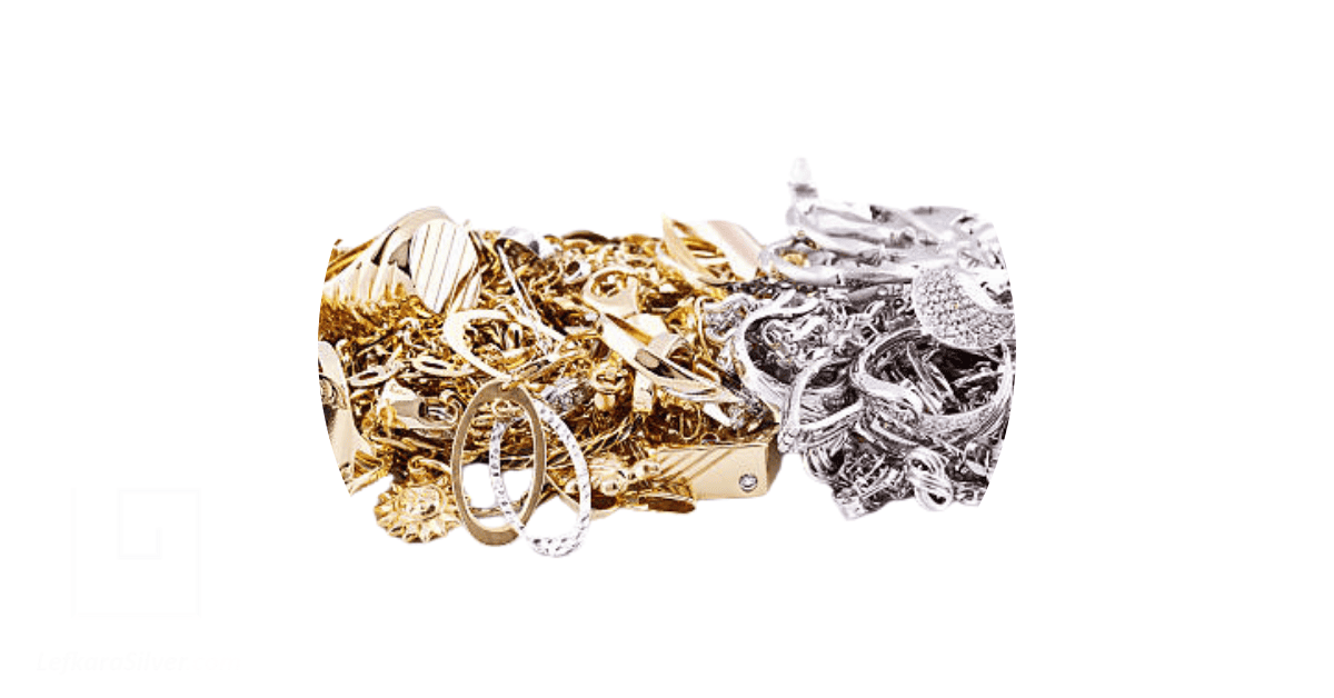a collection of gold jewelry on one side, and silver jewelry on the other
