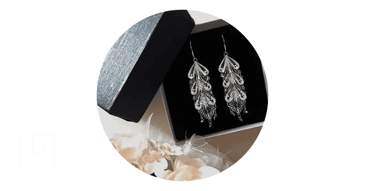 a pair of silver women's jewelry in an open gift box