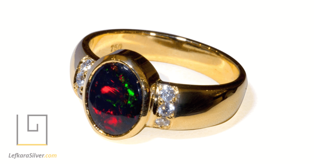 a stunning black opal ring with inlaid diamonds