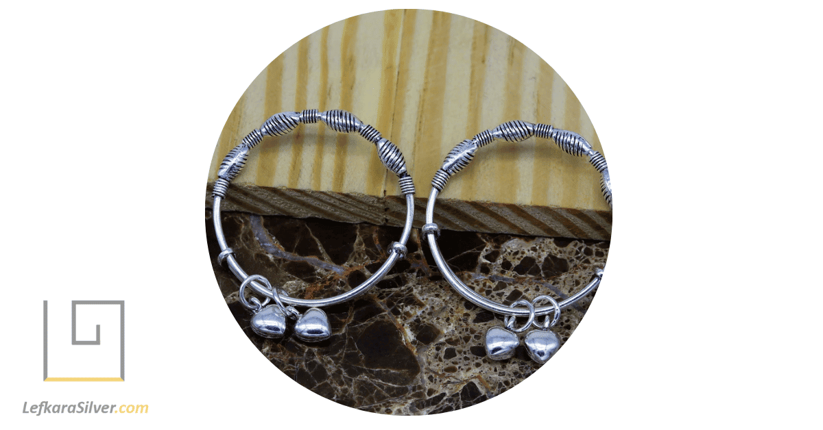 a pair of charm bangle bracelets