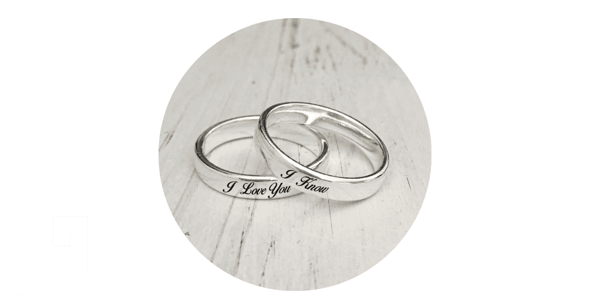 two pairs of customized silver rings with engravings on them