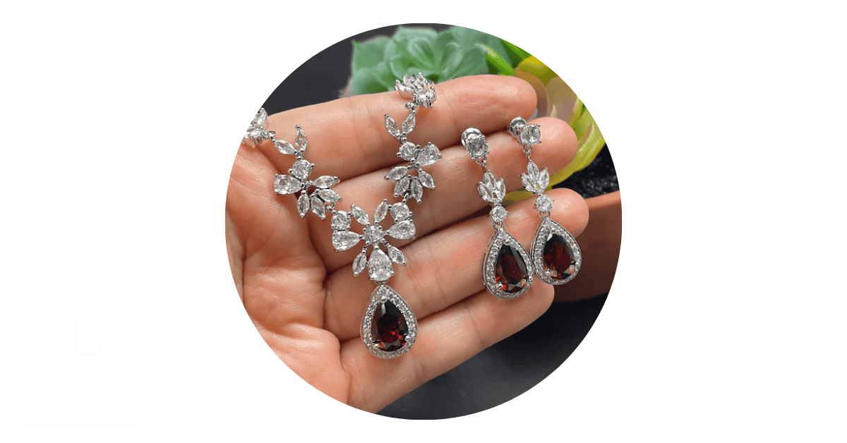 holding custom silver bridal set jewelry