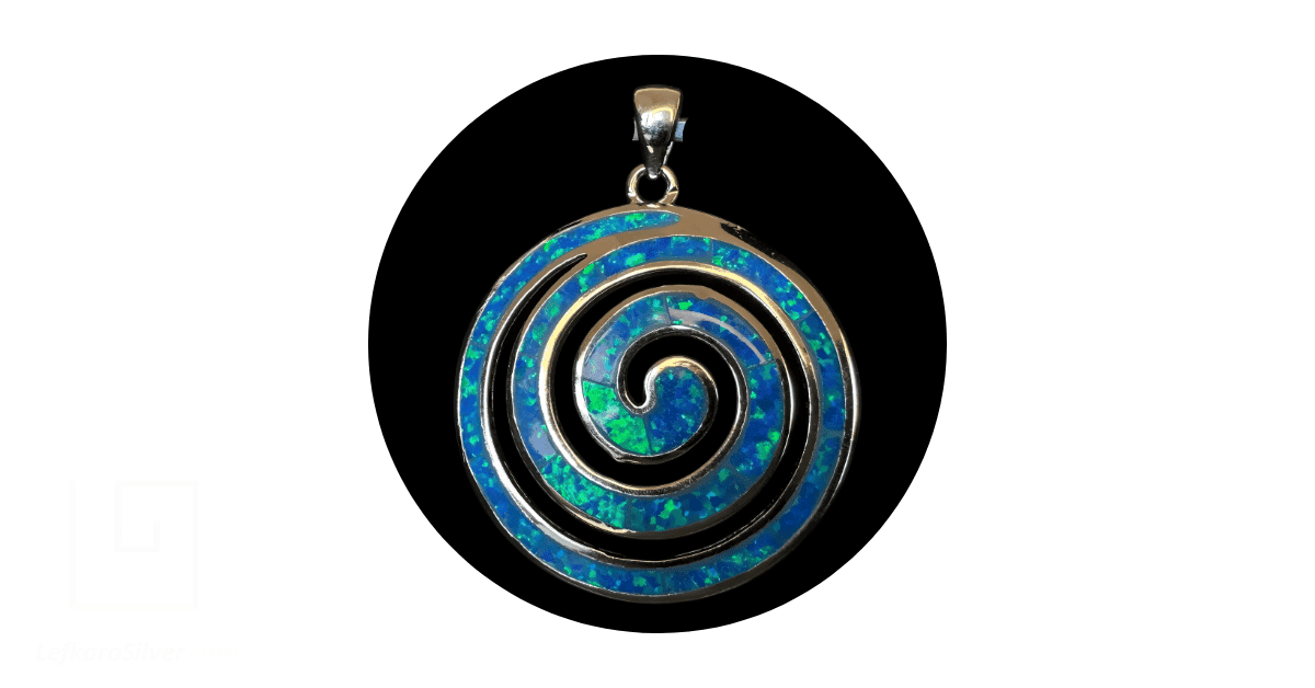 A handmade blue opal spiral pendant.