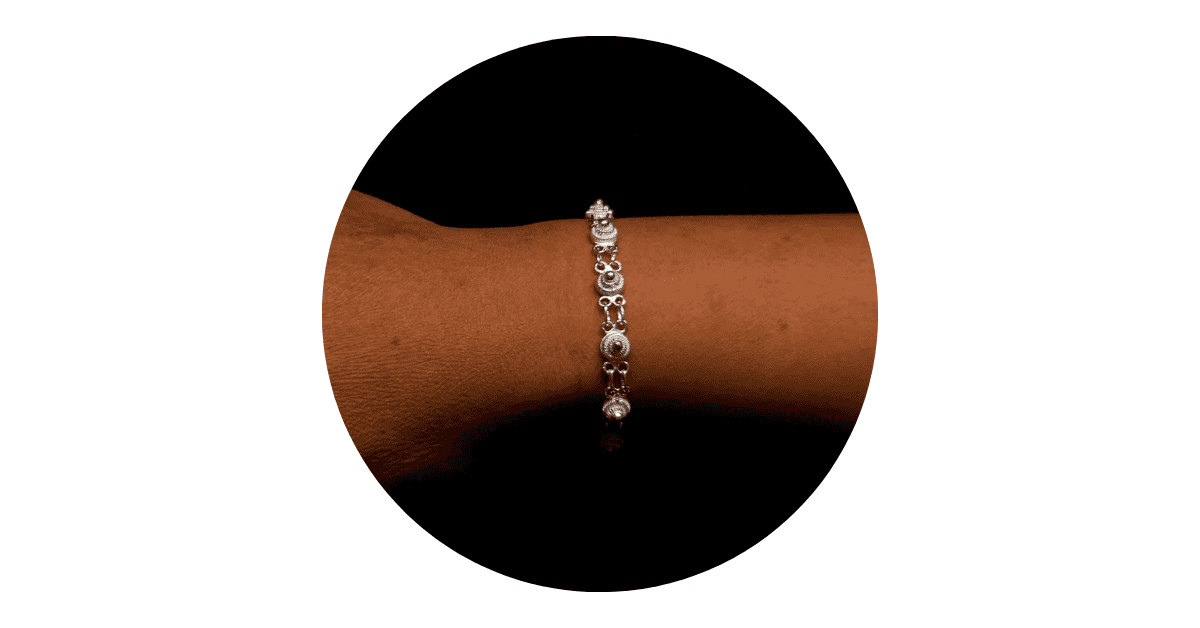 Elegant silver bracelet on wrist.