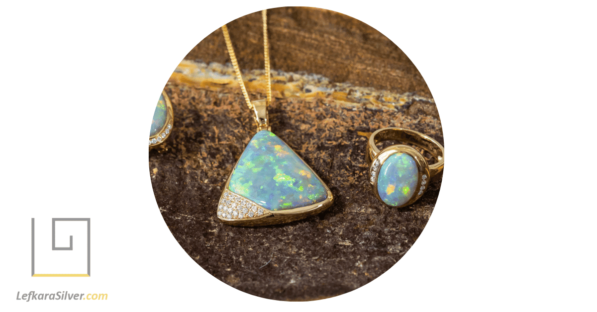 an opal pendant and opal ring set in gold