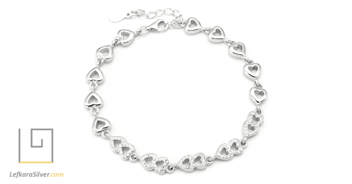 a silver bracelet with hearts