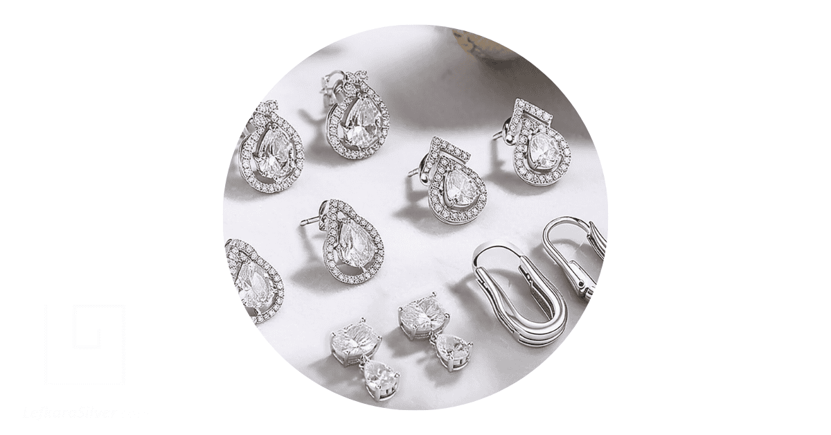 a collection of stud silver earrings