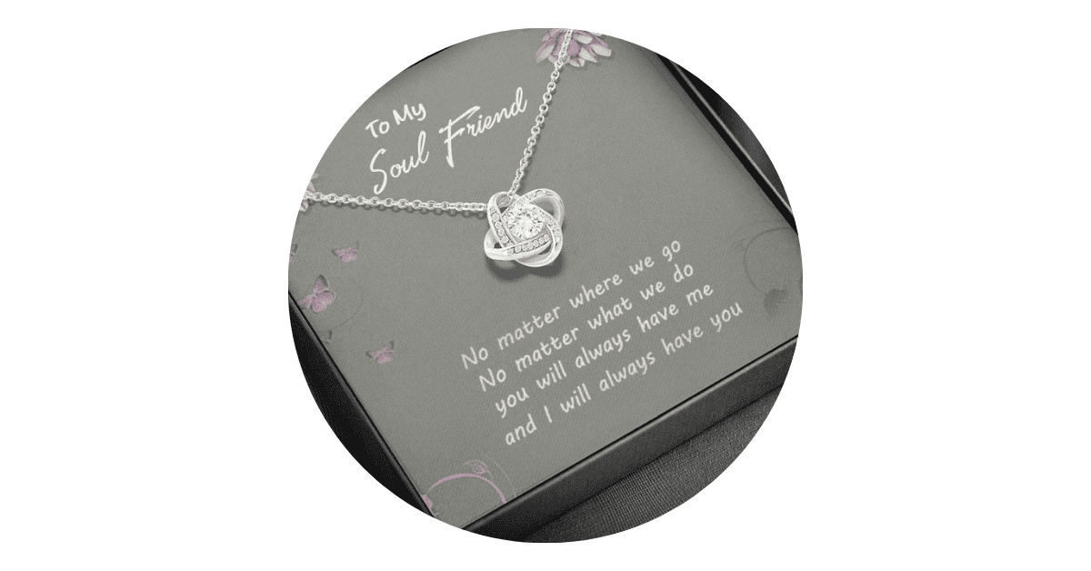 A gift box with a silver necklace and text indicating a gift to a friend