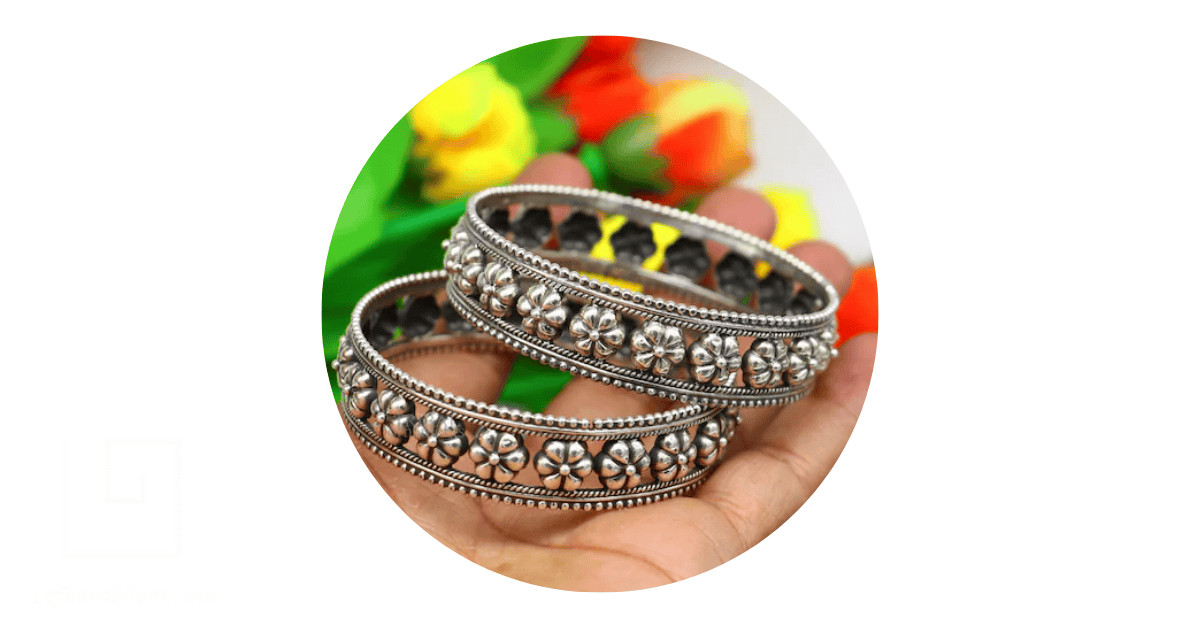 Intricate vintage sterling silver bangles with floral design