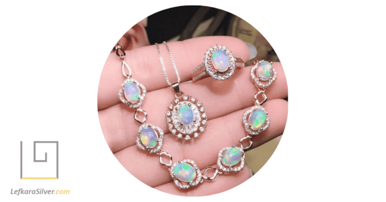 a person holding different types of opal birthstone jewelry