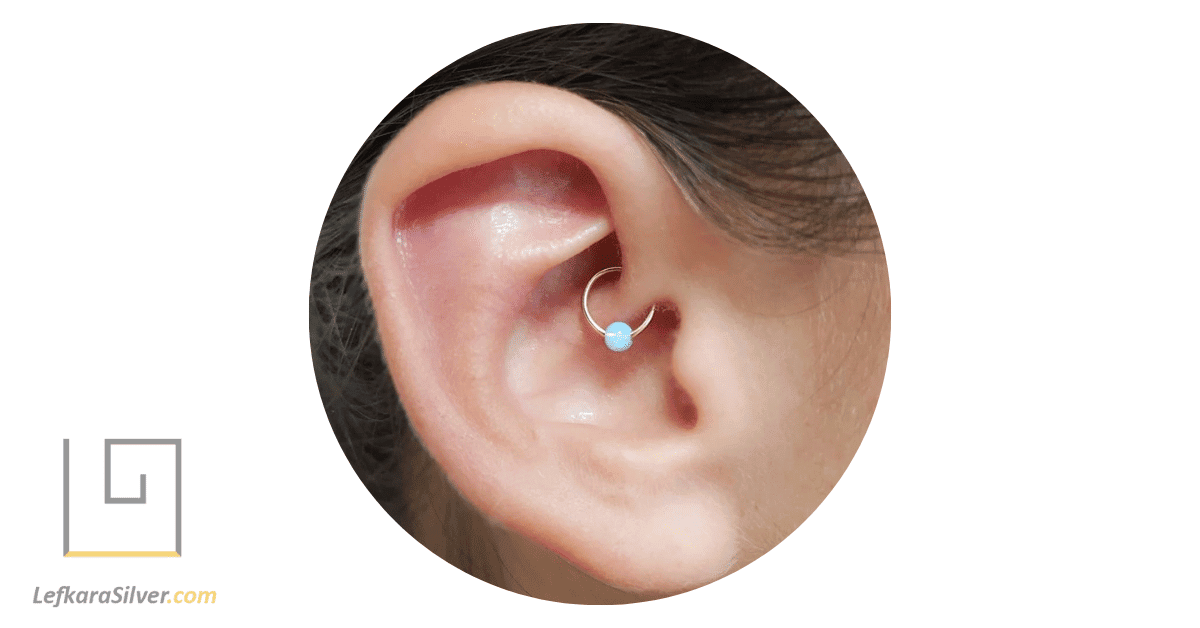 a woman's ear with Opal Daith Jewelry