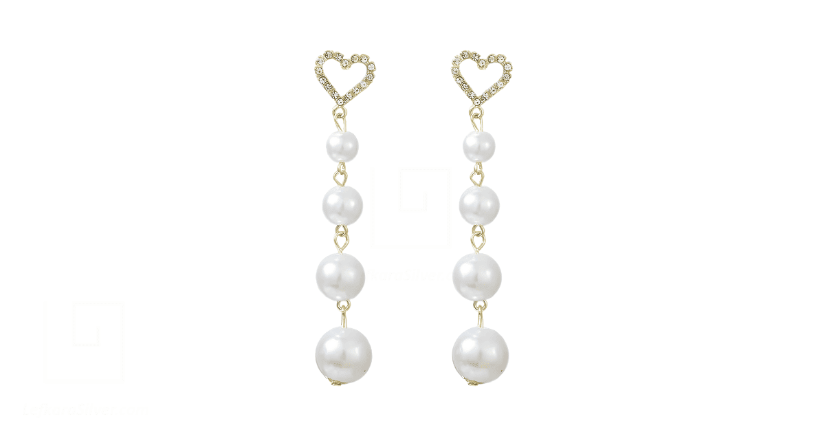 A pair of dangling heart-shaped pearl earrings.