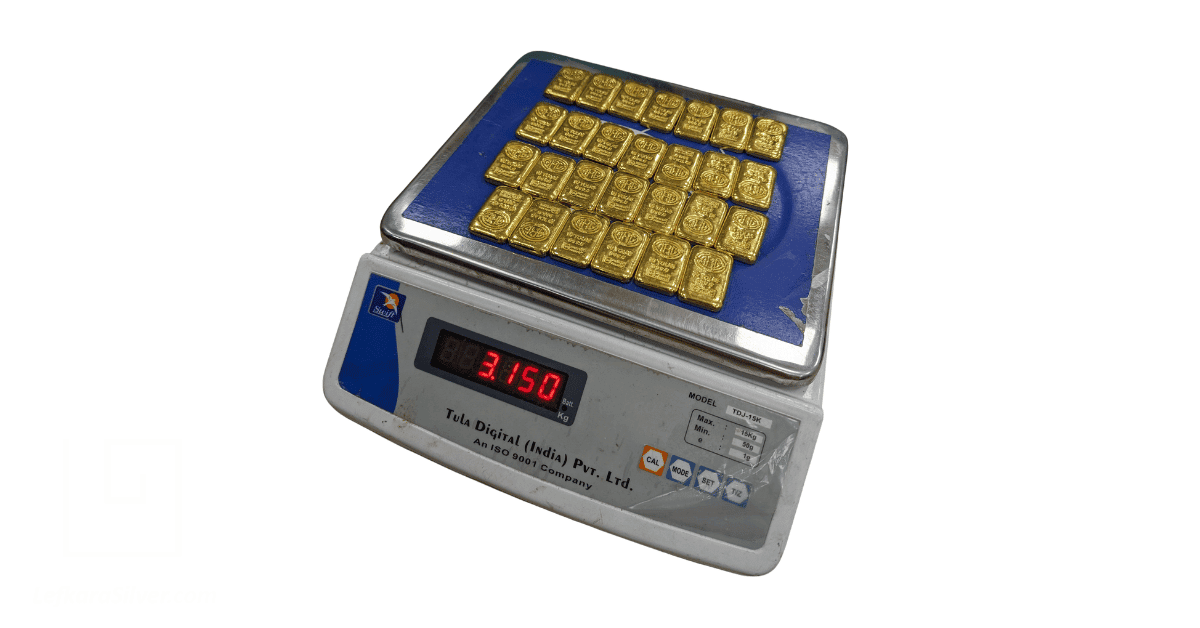 Gold bars on a testing machine. 