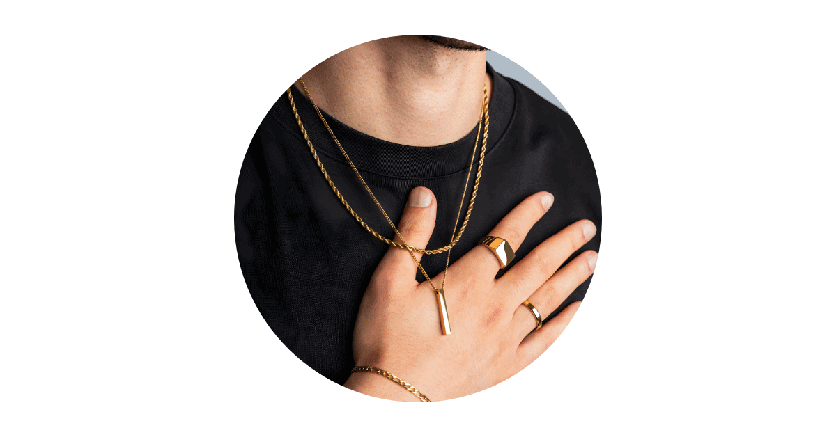 A person adorned with different types of men's jewelry.
