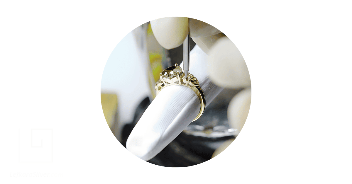 a person's hand creating a custom ring.