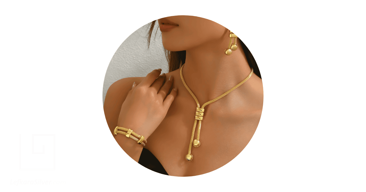 a woman weaing gold plated jewelry. 