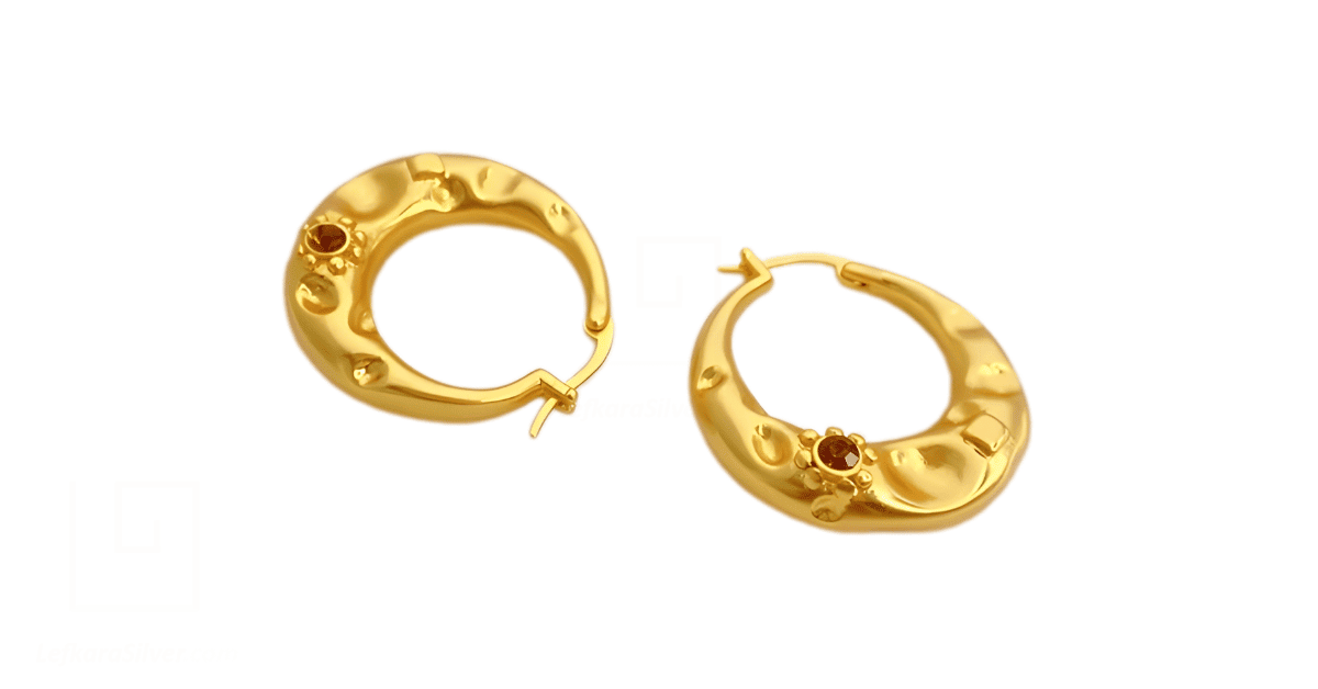 A pair of gold hoop earrings.
