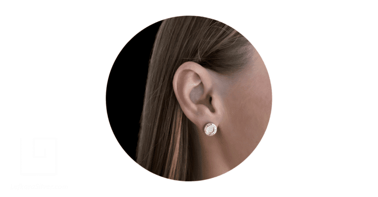 a woman's ear adorned with a simple gold stud earring from Lefkara Silbver.
