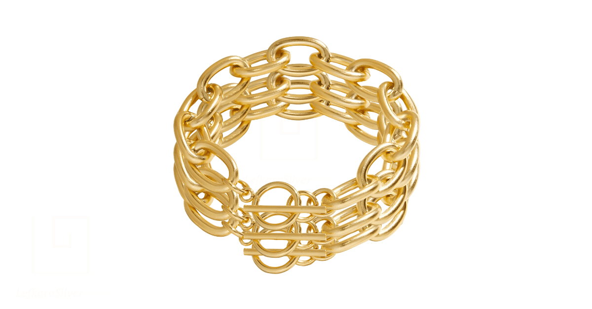 a stack of gold bracelets. 