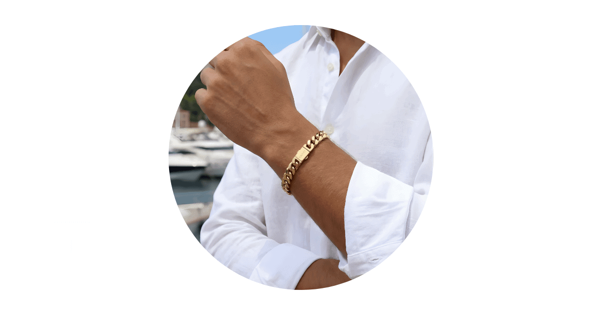 A man wearing a gold bracelet. 