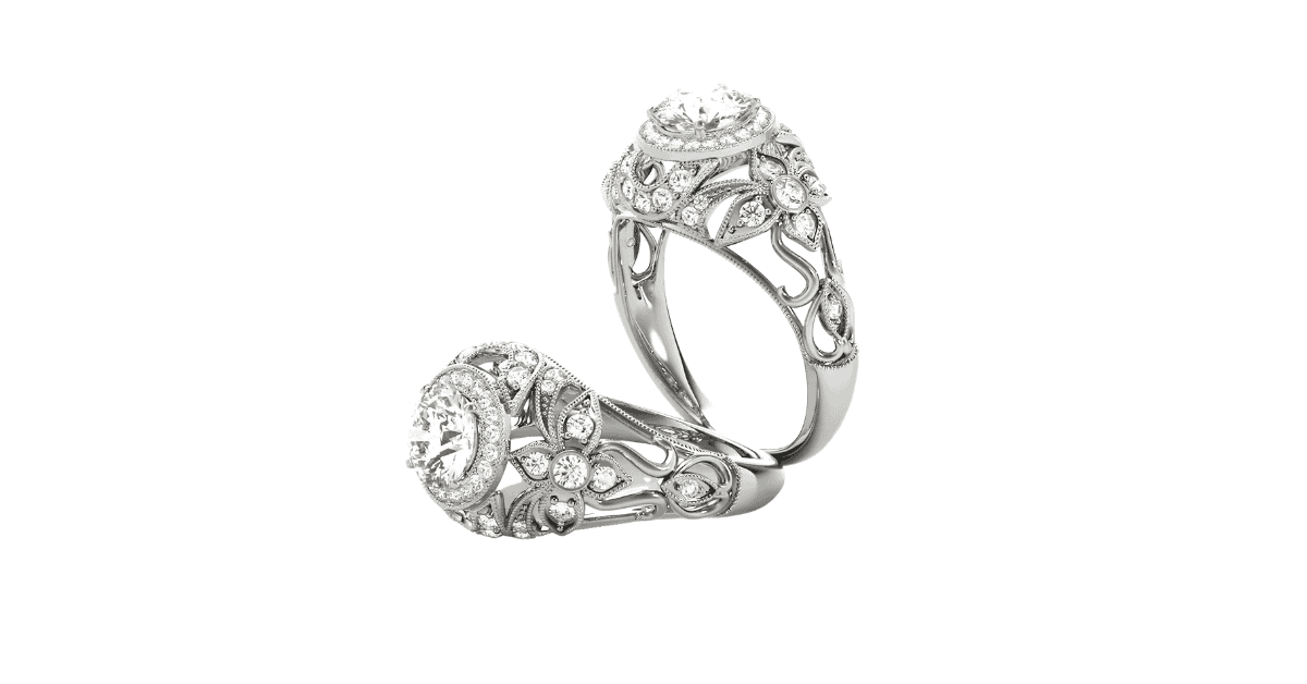 Two silver filigree engagement rings with diamonds.