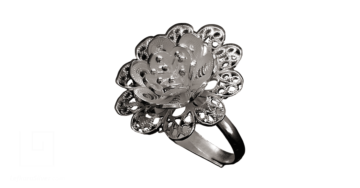a white gold filigree ring.