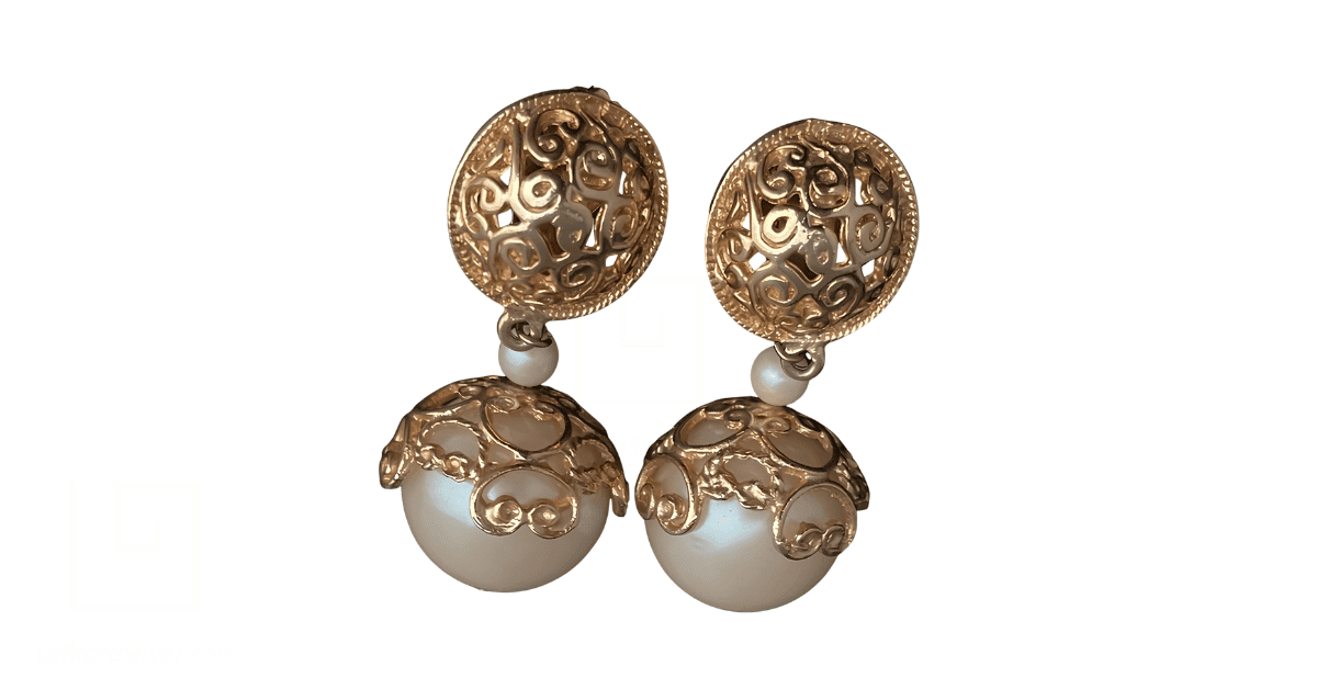 a pair of vintage gold filigree earrings.