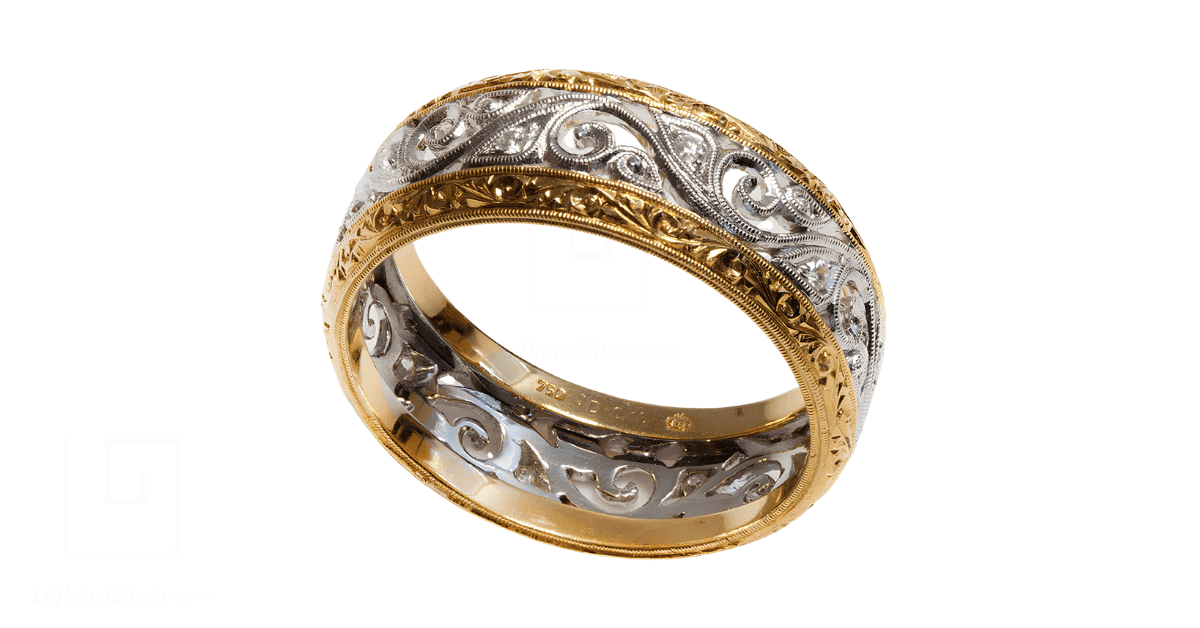 a gold filigree wedding band with diamonds.
