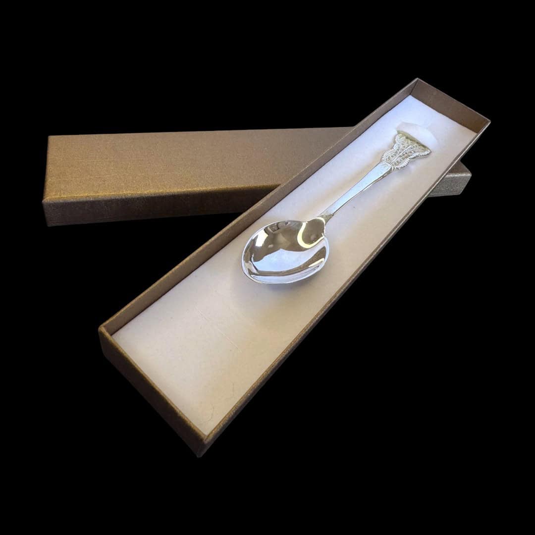 Handmade silver filigree christening teaspoon with an ornate scrolled openwork handle, by Lefkara Silver Cyprus.