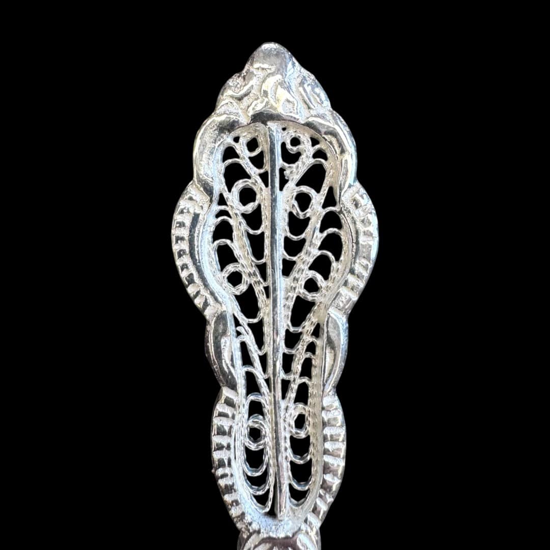 Handmade silver filigree christening teaspoon with an ornate scrolled openwork handle, by Lefkara Silver Cyprus.