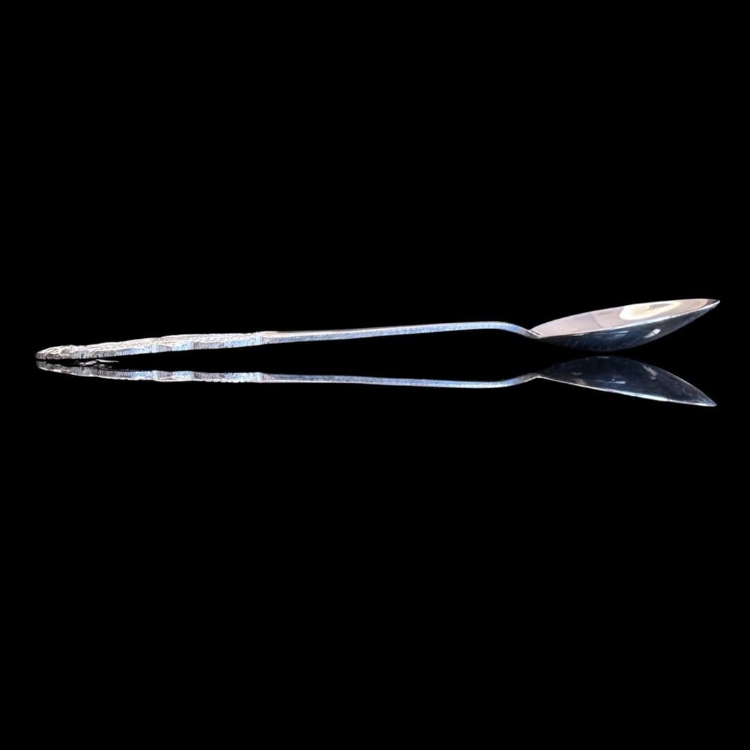 Handmade silver filigree christening teaspoon with an ornate scrolled openwork handle, by Lefkara Silver Cyprus.