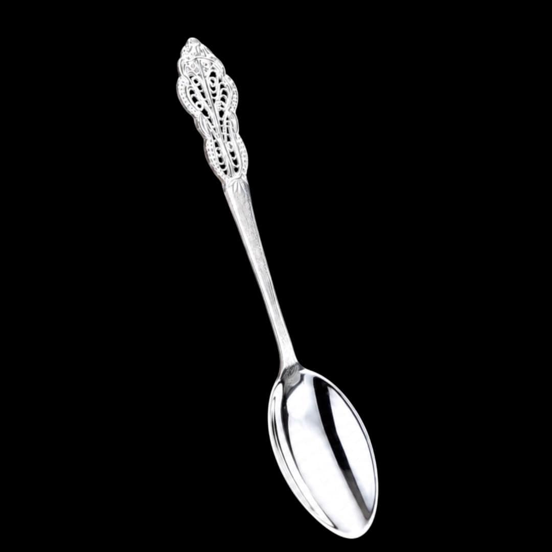 Handmade silver filigree christening teaspoon with an ornate scrolled openwork handle, by Lefkara Silver Cyprus.