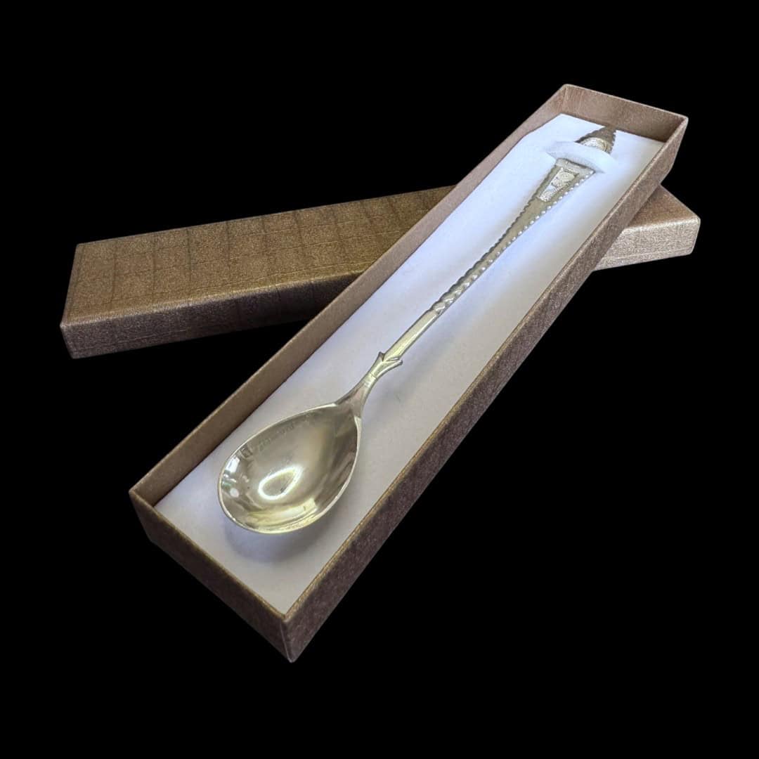 Long handmade silver filigree spoon with a slender lance-shaped openwork handle, by Lefkara Silver Cyprus.