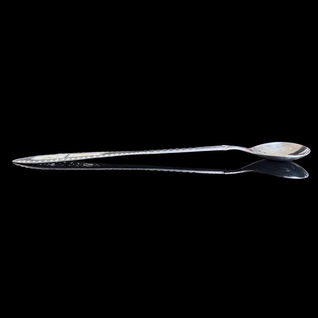 Long handmade silver filigree spoon with a slender lance-shaped openwork handle, by Lefkara Silver Cyprus.