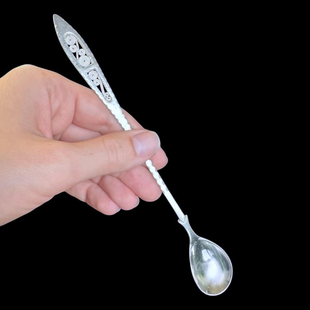 Long handmade silver filigree spoon with a slender lance-shaped openwork handle, by Lefkara Silver Cyprus.