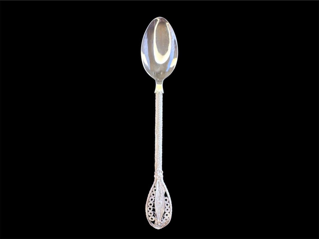 Handmade silver filigree spoon with a twisted stem and teardrop openwork handle, by Lefkara Silver Cyprus.
