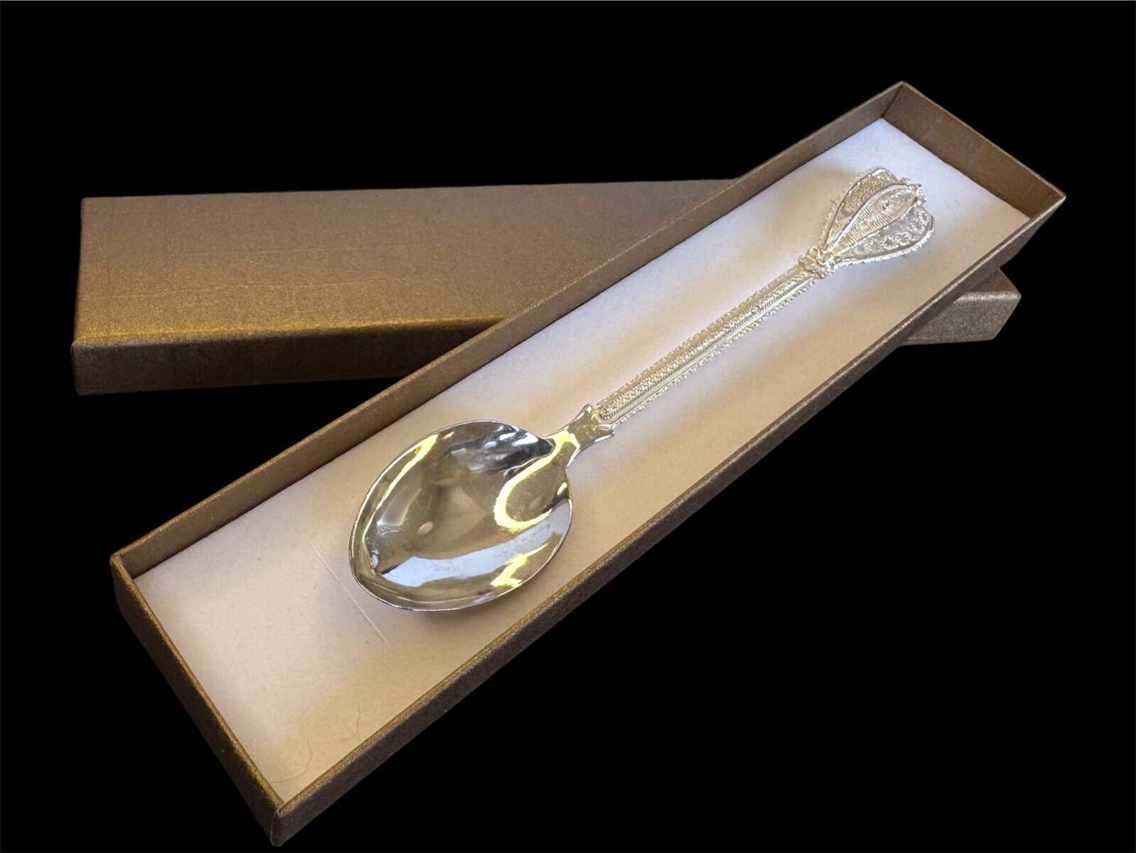 Handmade silver filigree spoon with a twisted stem and teardrop openwork handle, by Lefkara Silver Cyprus.