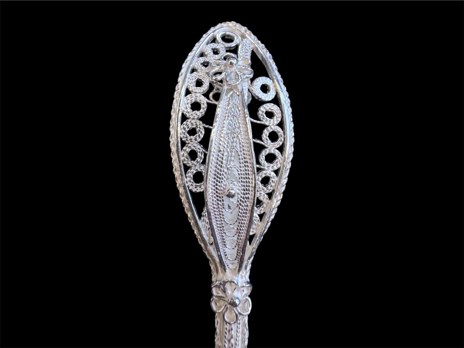 Handmade silver filigree spoon with a twisted stem and teardrop openwork handle, by Lefkara Silver Cyprus.